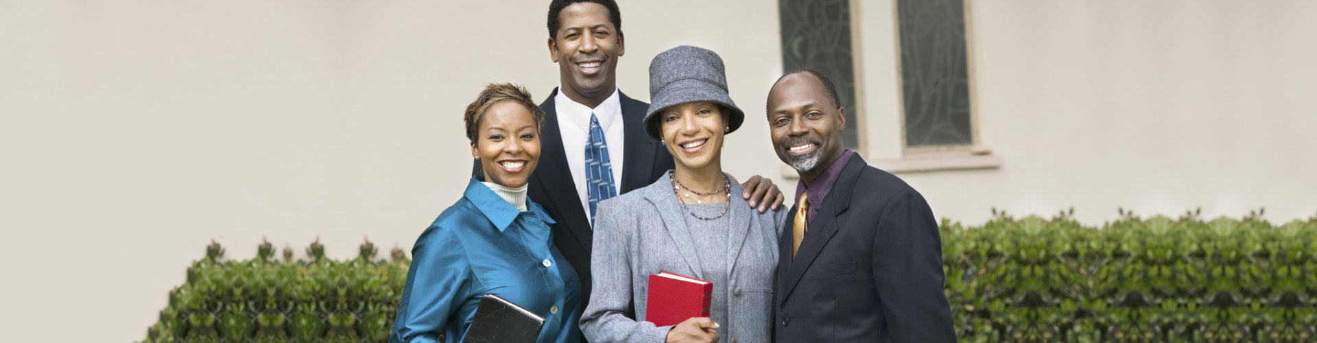 four people smiling